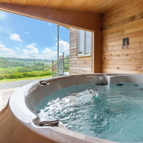 Embrace the natural elements from the warmth of the hot tub