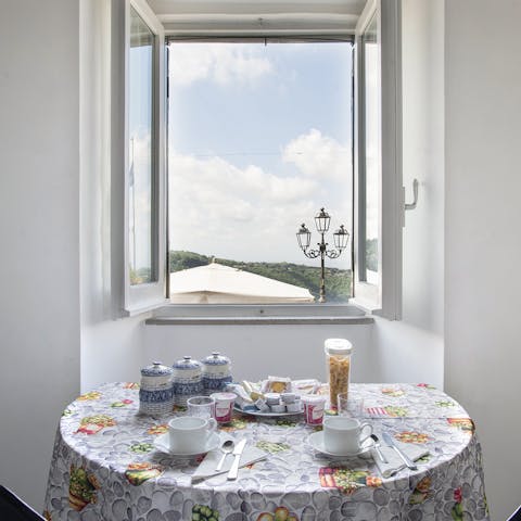 Enjoy breakfast accompanied with views across Nemi