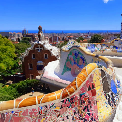 Explore Gaudi's majestic architecture at Park Güell, a direct bus ride away