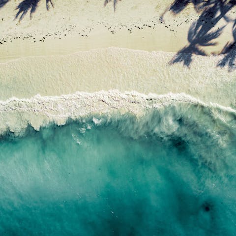 Explore beautiful Zanzibar, including its beaches and the nearby Kuza Cave