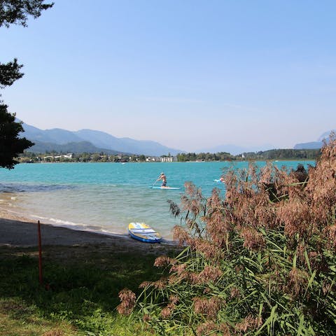 Visit Lake Faak for a day of water sports such as paddle boarding and sailing