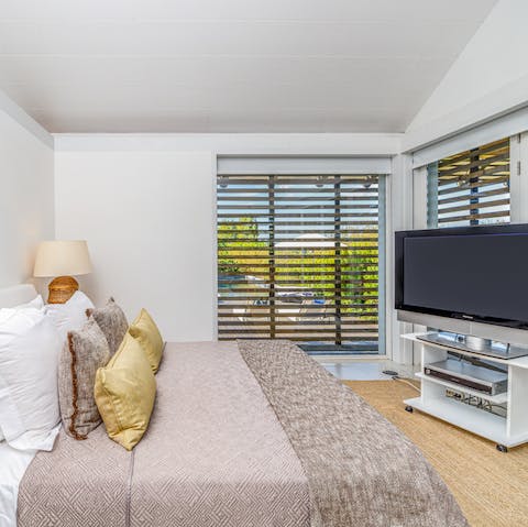Draw the blinds and let sunlight stream into the cosy bedroom as you greet the day
