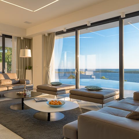 Take in the view at sunset from the wall of glass in the living room