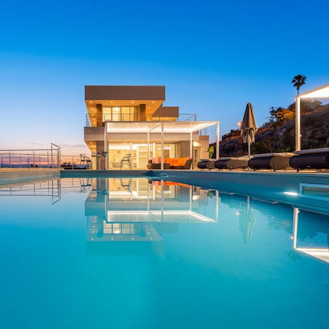 Enjoy a twilight dip in the sparkling swimming pool