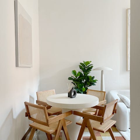 Sit down for leftover pizza at the stylish dining table