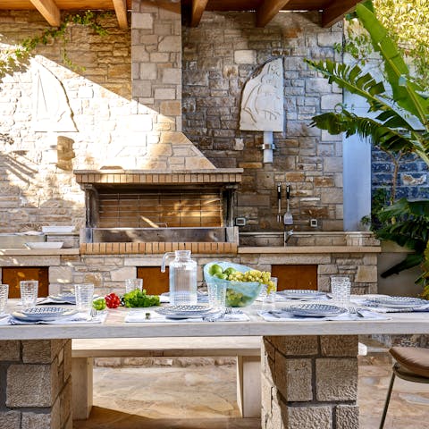 Prepare a feast of Greek specialties in the outdoor kitchen