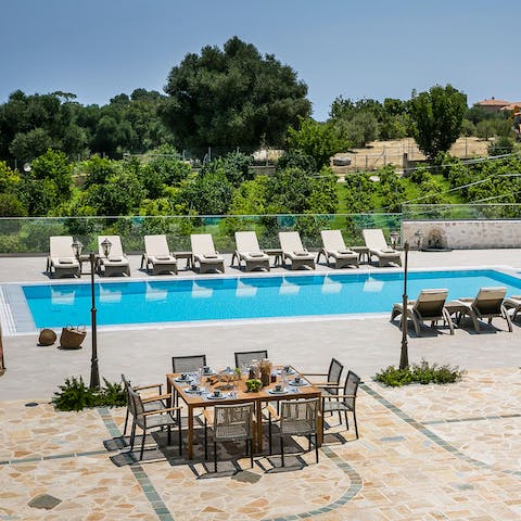 Dine poolside with a view of the Vineyard