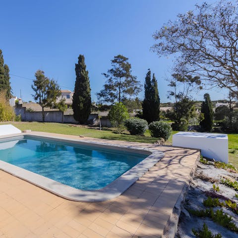 Enjoy a cooling dip in the pool and lazy afternoons in the shade 