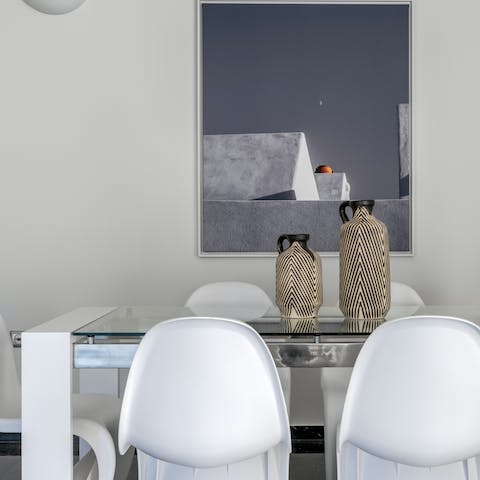 Gather at the elegant dining table for communal feasts 