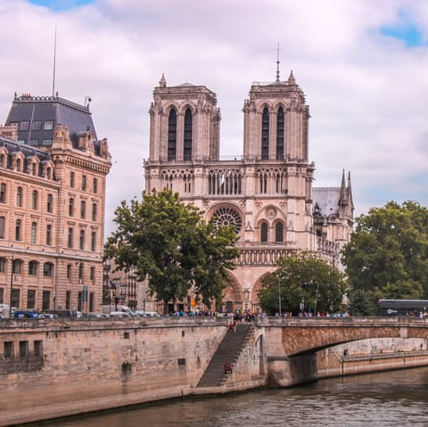 Stroll ten minutes across the Seine to Notre Dame Cathedral