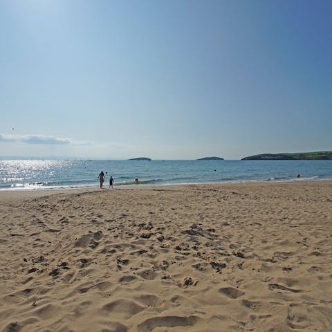 Stroll along the golden sands of Pwllheli Traeth Marian-y-de Beach, a five-minute drive away