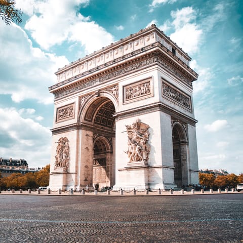 Pay a visit to the Arc de Triomphe, only a quick walk away