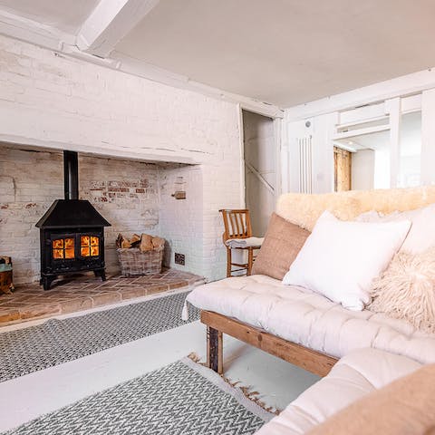 Warm yourself by the log burner after a long walk on the beach