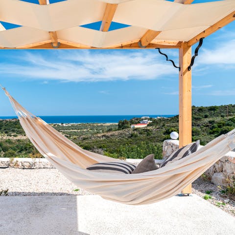 Admire the stunning ocean view from the hammock as you chill out