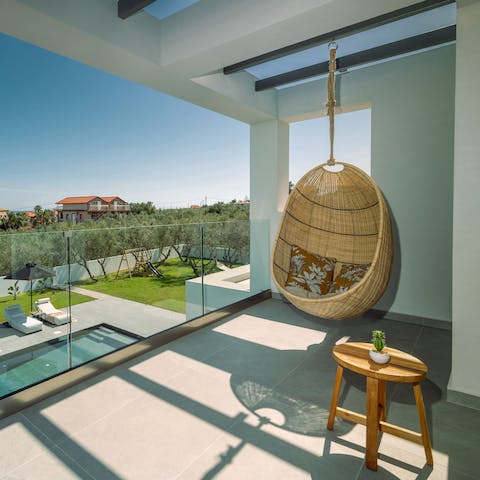 Start the day with coffee on the balcony in the comfy swinging chair