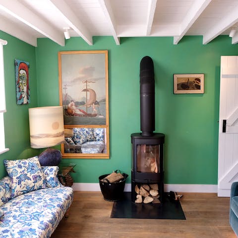 Unwind beside the log burner after walking along the beach