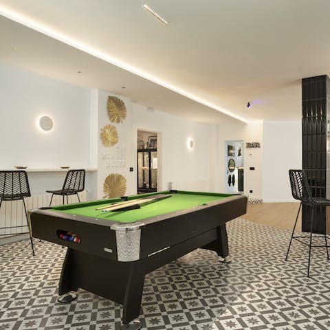 Challenge each other to games of pool in the stylish games room