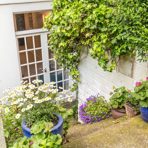 Step out onto your private flower-filled patio