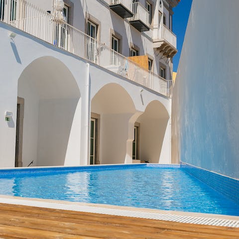 Slide into the refreshing communal pool after a day of exploring