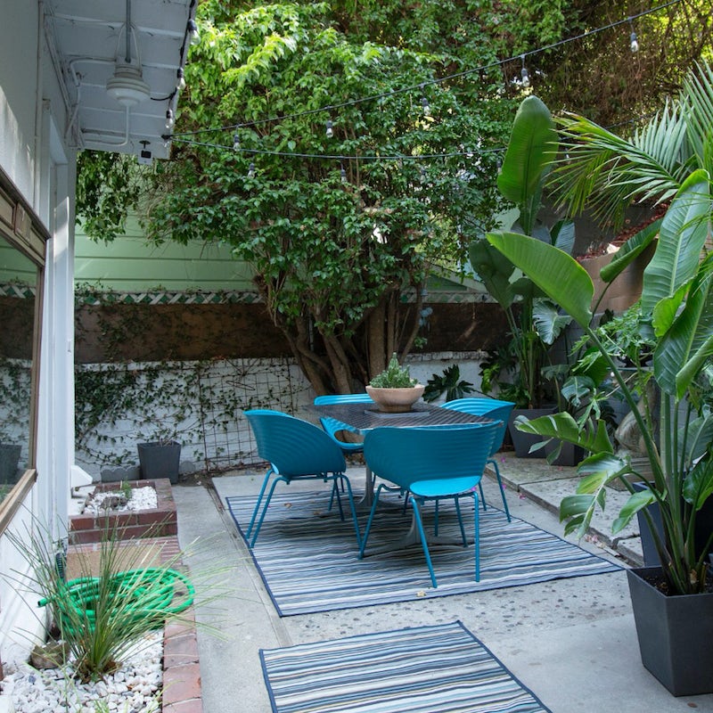 Dine or sip something cold amidst the lush plants on the patio