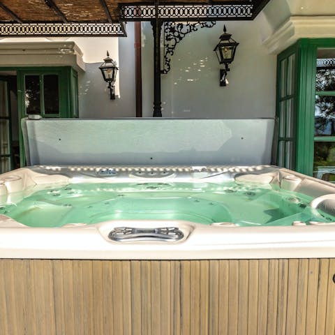 Luxuriate in the bubbling water of the hot tub after a busy day