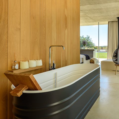 Soak your muscles in the main bedroom's deep bath tub