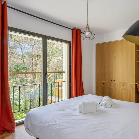 Wake up to serene views across the trees and enjoy the simple charm of this home