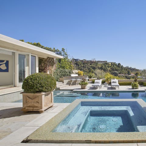 Slip into your swimwear and hit the home's swimming pool and spa pool