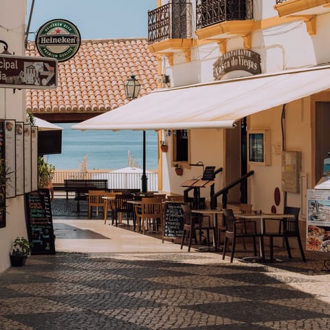 Enjoy the picturesque cafes, restaurants, and taverns of Albufeira