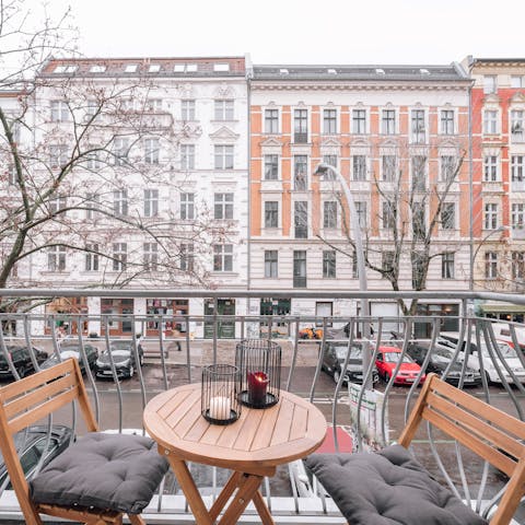 Enjoy a balcony view of the restored pre-war architecture