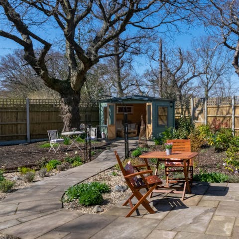 Relax in the peaceful garden, sipping cocktails in the summer house