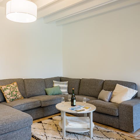 Snuggle down on your expansive corner sofa with a bottle of wine after a day in the great outdoors
