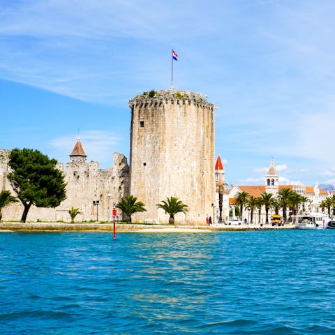 Drive out 2.5 kilometres to the ancient centre of coastal Trogir