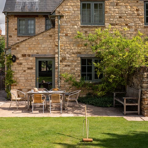 Enjoy quiet mornings on the small patio or play a game of croquet in the afternoon sun