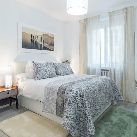 Get some rest on one of the comfy beds after a busy day in Madrid