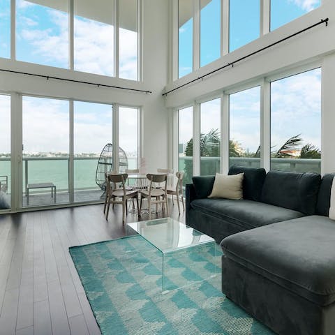 Enjoy the panoramic view of the bay from the open-plan living room