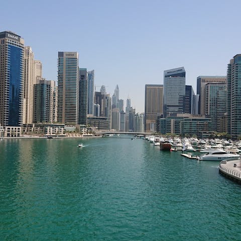 Explore Dubai Marina with its scenic promenade, shops and restaurants