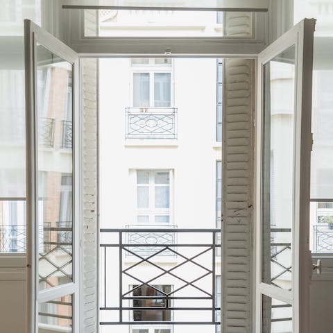 Step out onto the small private balcony with a morning espresso