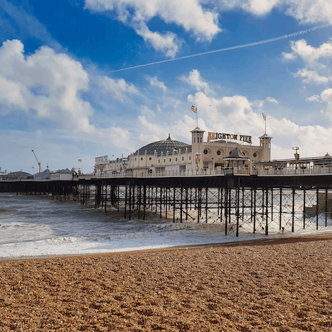 Take a sixteen-minute walk down to the Brighton Pier and beach
