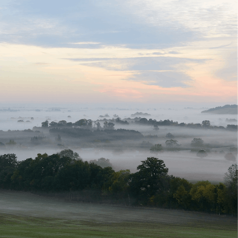 Follow hiking trails through the Cotswolds countryside 