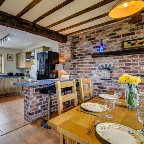 Admire original features such as exposed beams and brickwork