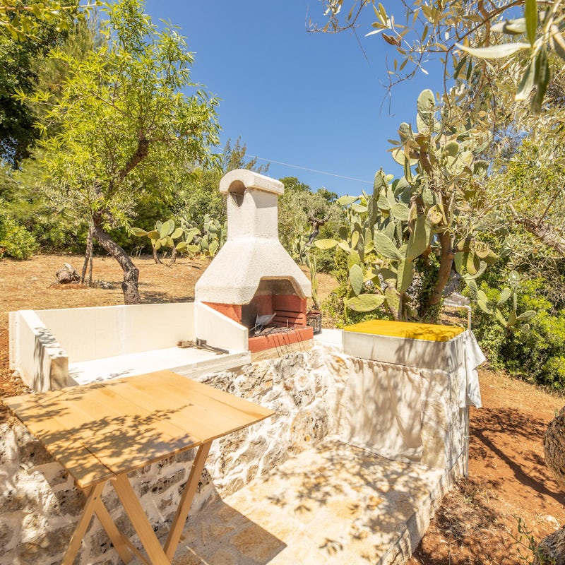 Cook meals beneath the Puglian sun at the stone-built barbecue station