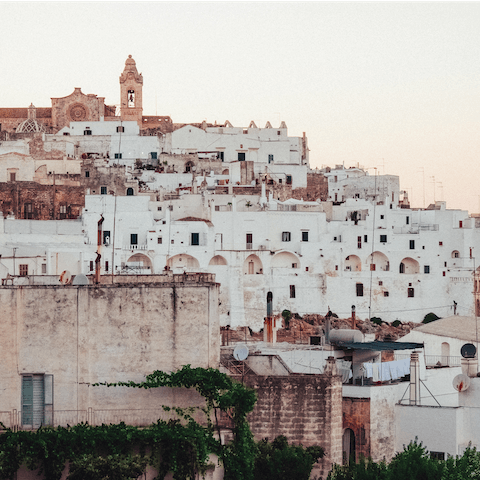 Explore layer upon layer of ancient streets in the charming town of Ostuni, a short drive away