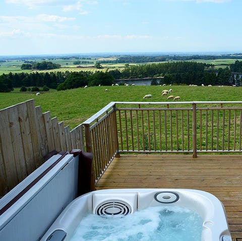 Drink in the views of the fells and reservoir from your private hot tub
