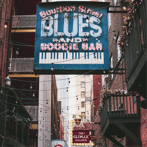 Follow the jazz beats down to Bourbon Street, just a ten-minute streetcar ride away