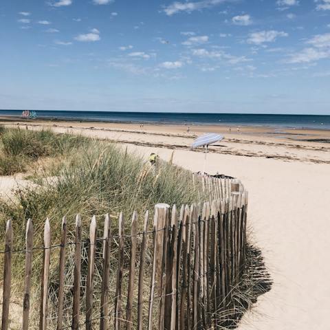 Sink your toes into the soft dunes at Juno Beach, a short walk away