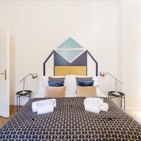 Enjoy modernist touches throughout, like the geometric headboard