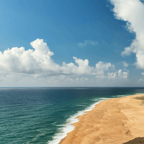 Visit Comporto's stunning beach, and enjoy a glass of sangria in a beach bar