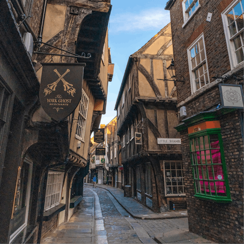 Amble the vibrant streets of The Shambles in York, just a  twelve-minute drive away