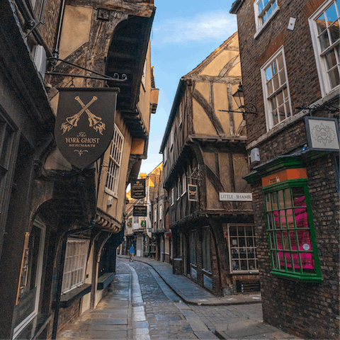 Amble the vibrant streets of The Shambles in York, just a  twelve-minute drive away